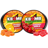 Two containers of KBomb gummies, one orange burst and one cherry smile, with gummies displayed in front.