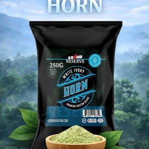 KSM-66 Reserve White Ivory Horn package with green powder in a wooden bowl against a forest background