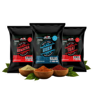 Three black spice packages with labels and three wooden bowls of spices on a white background.