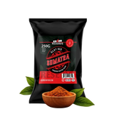 Black package of Sumatra coffee with a bowl of ground coffee and leaves on a white background